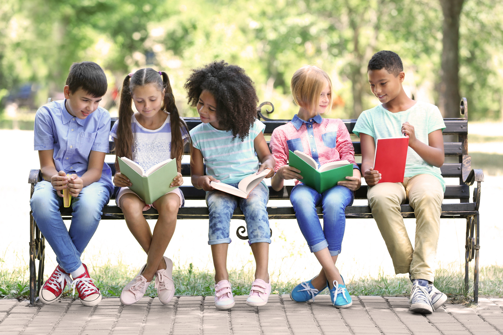 Kids Reading Books on Bench